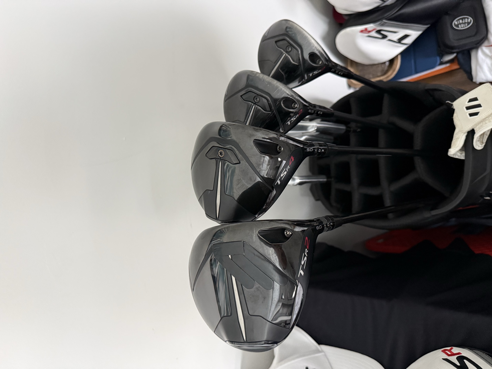 Close-up photo of golf clubs in a golf bag.